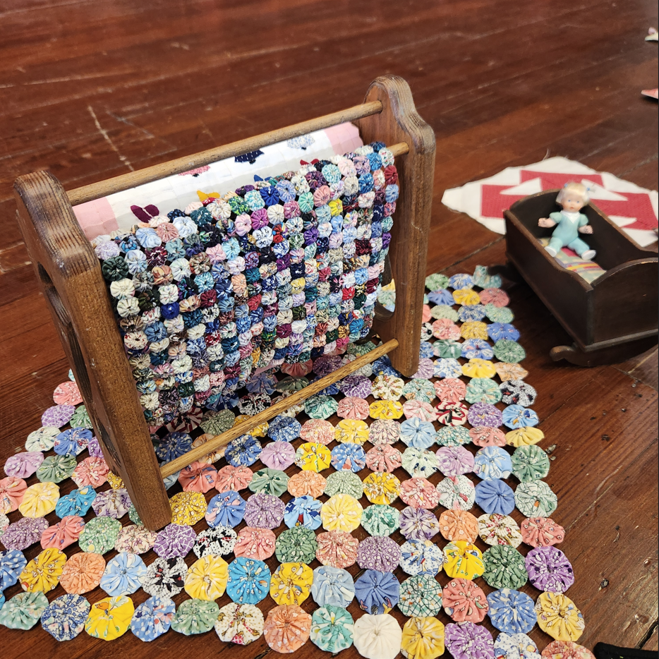 quilt display showing circle patterns